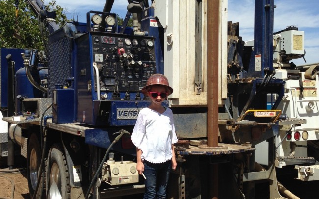 little girl at the drilling site