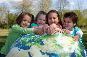 4 children hugging the earth